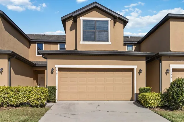 a front view of a house with a garage