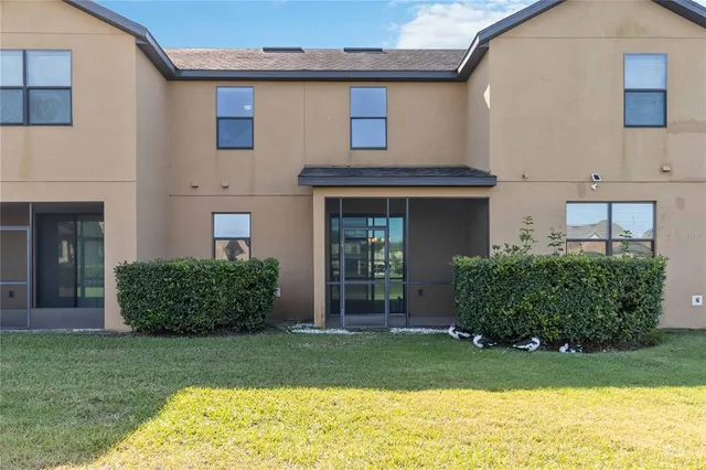 a view of a city with lawn chairs and ocean view