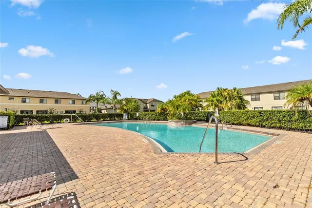 a view of a street with palm trees