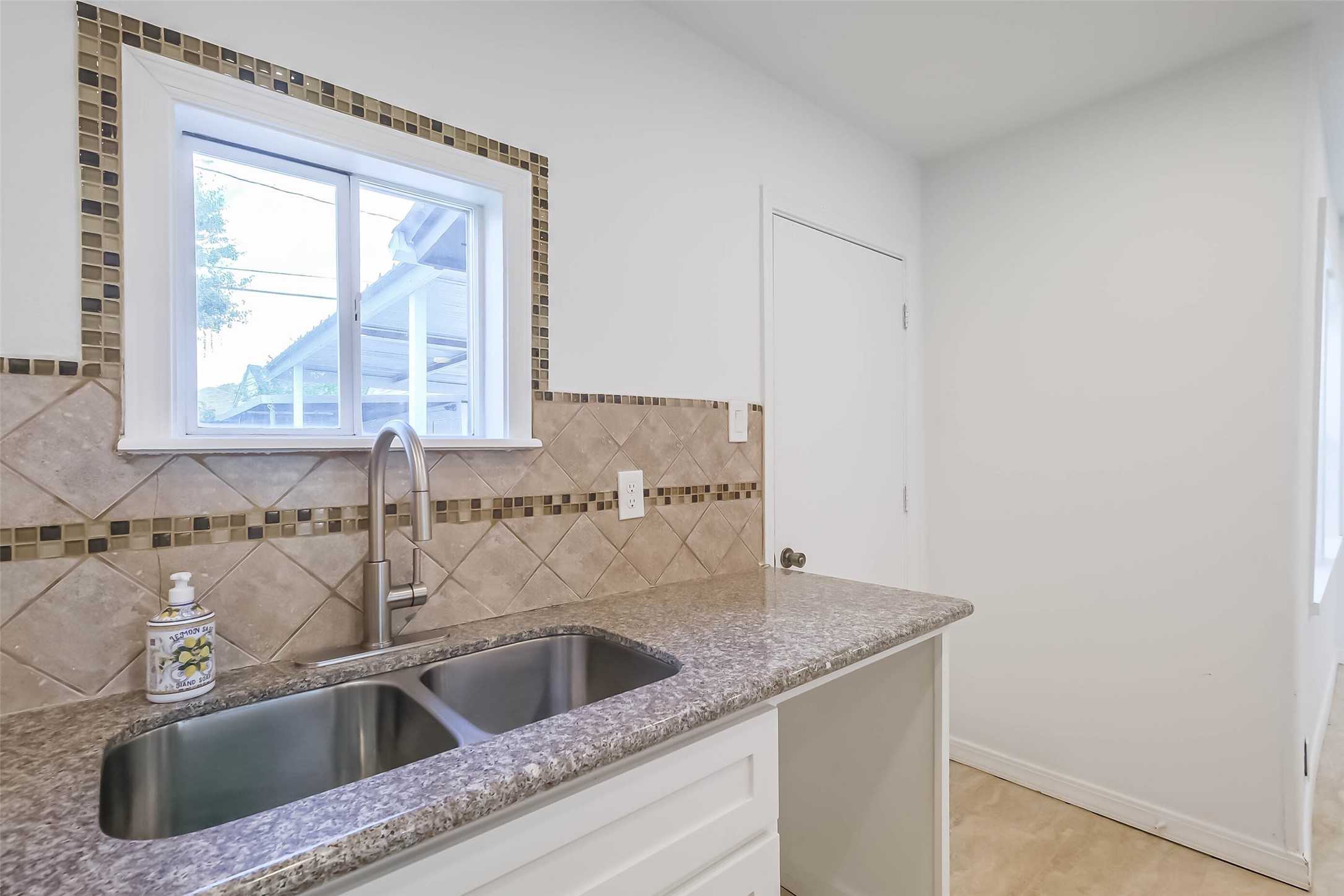 7543 Greenstone Street Houston, TX 77087 - Photo 9 of 24 a close view of sink and tap