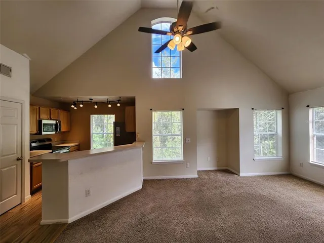 a view of a kitchen with a sink cabinet and a window