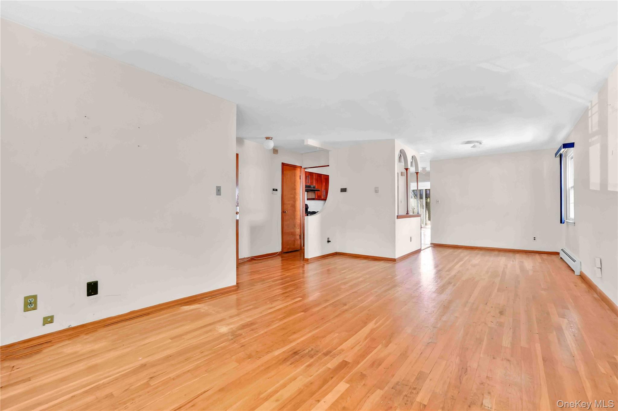 21260 16th Avenue Queens, NY 11360 - Photo 14 of 37 a view of empty room with wooden floor