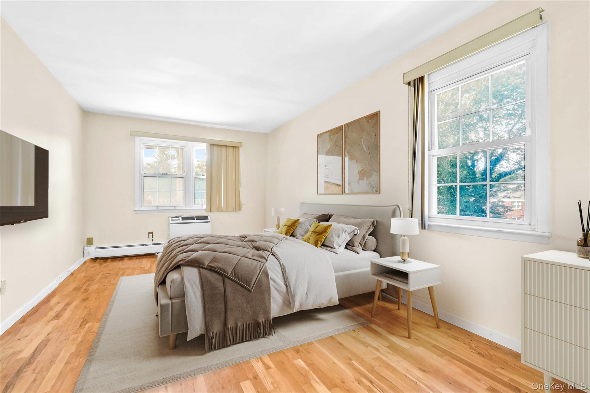 21260 16th Avenue Queens, NY 11360 - Photo 17 of 37 a bedroom with a bed and a window