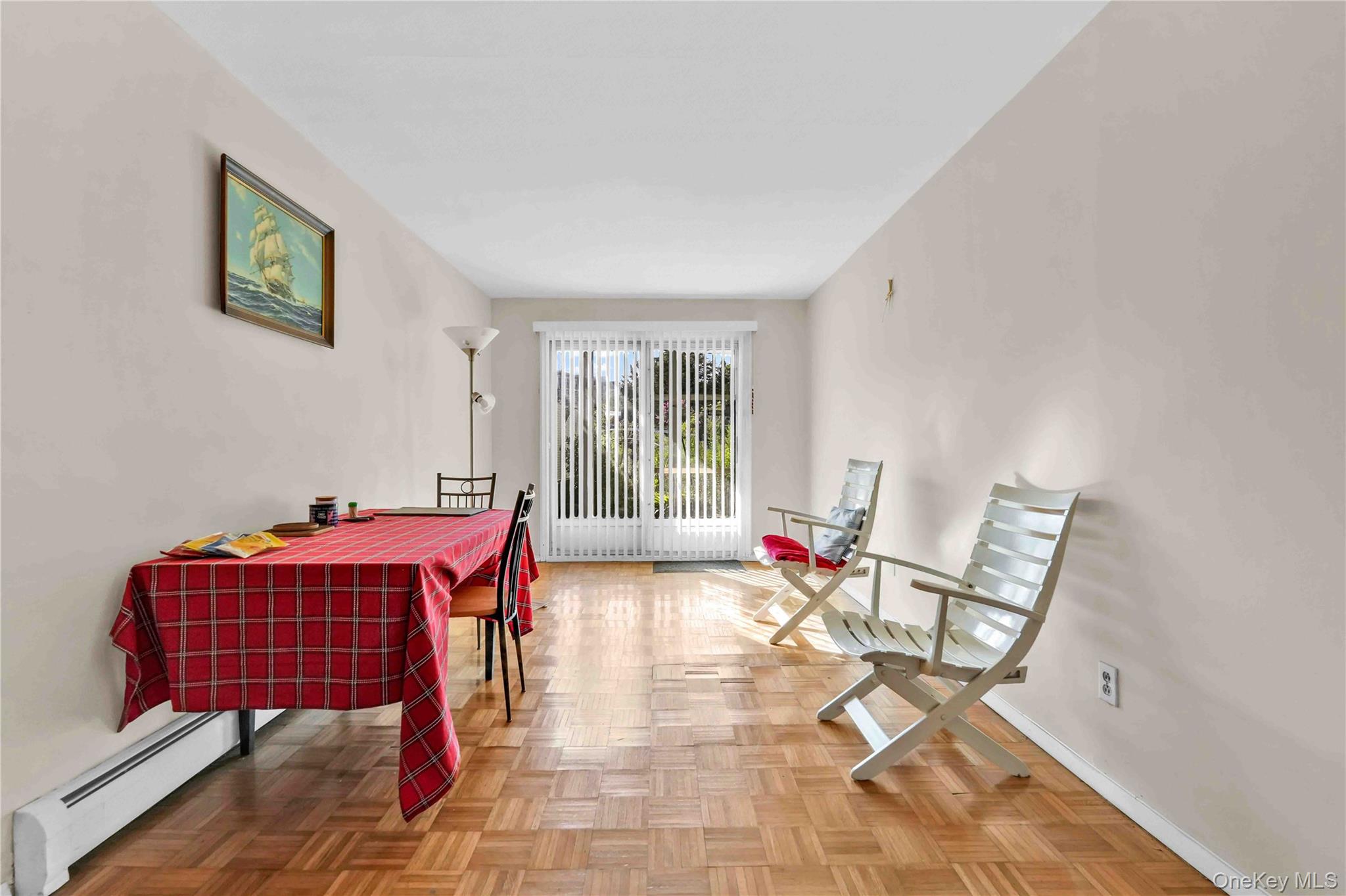21260 16th Avenue Queens, NY 11360 - Photo 25 of 37 a dining room with a couch and a table