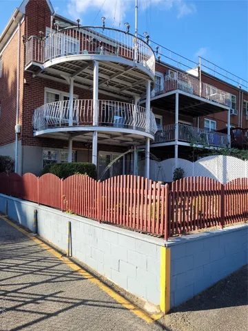 a view of a cars park on the side of a road