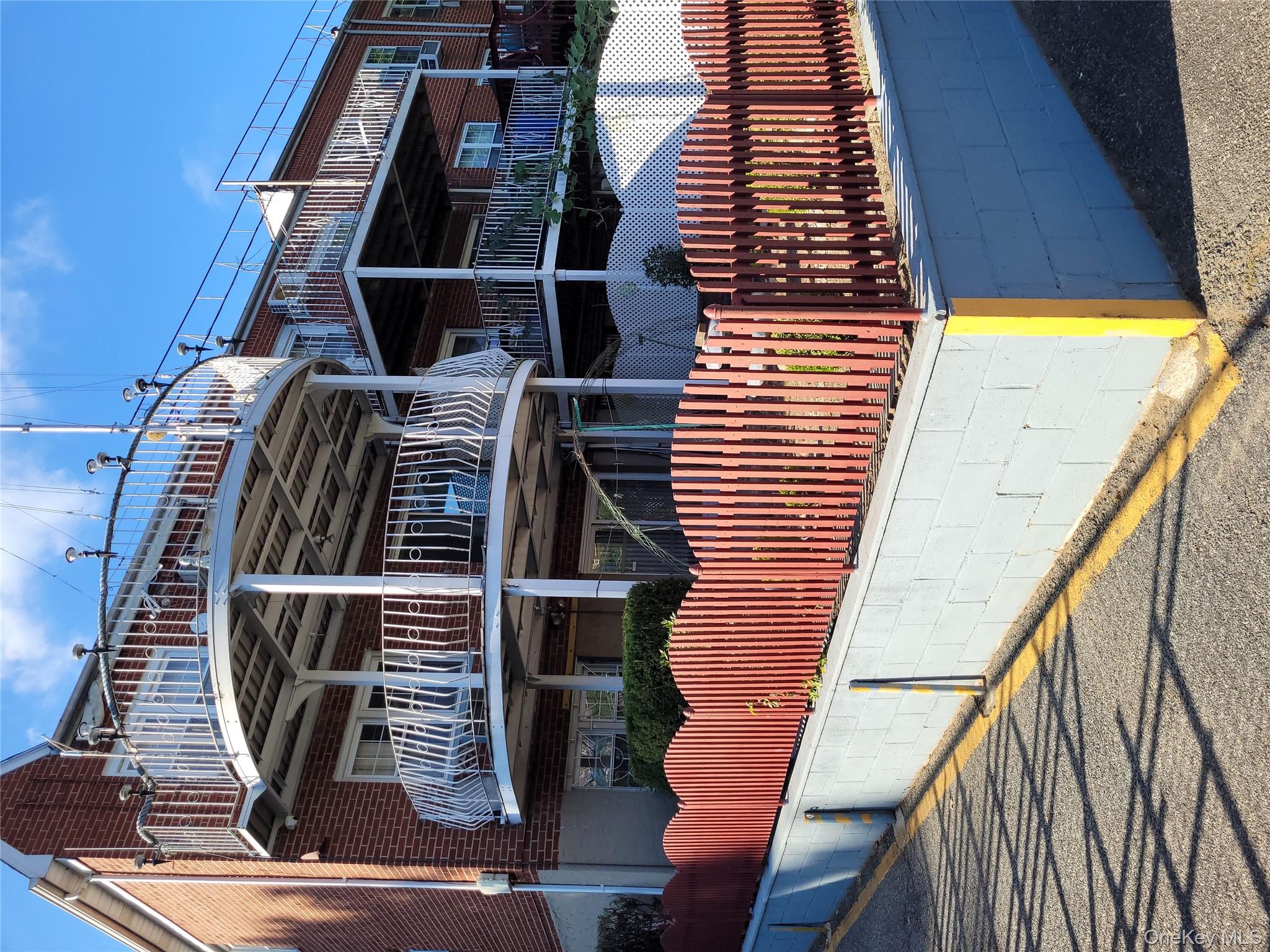 21260 16th Avenue Queens, NY 11360 - Photo 35 of 37 a view of a house with a deck