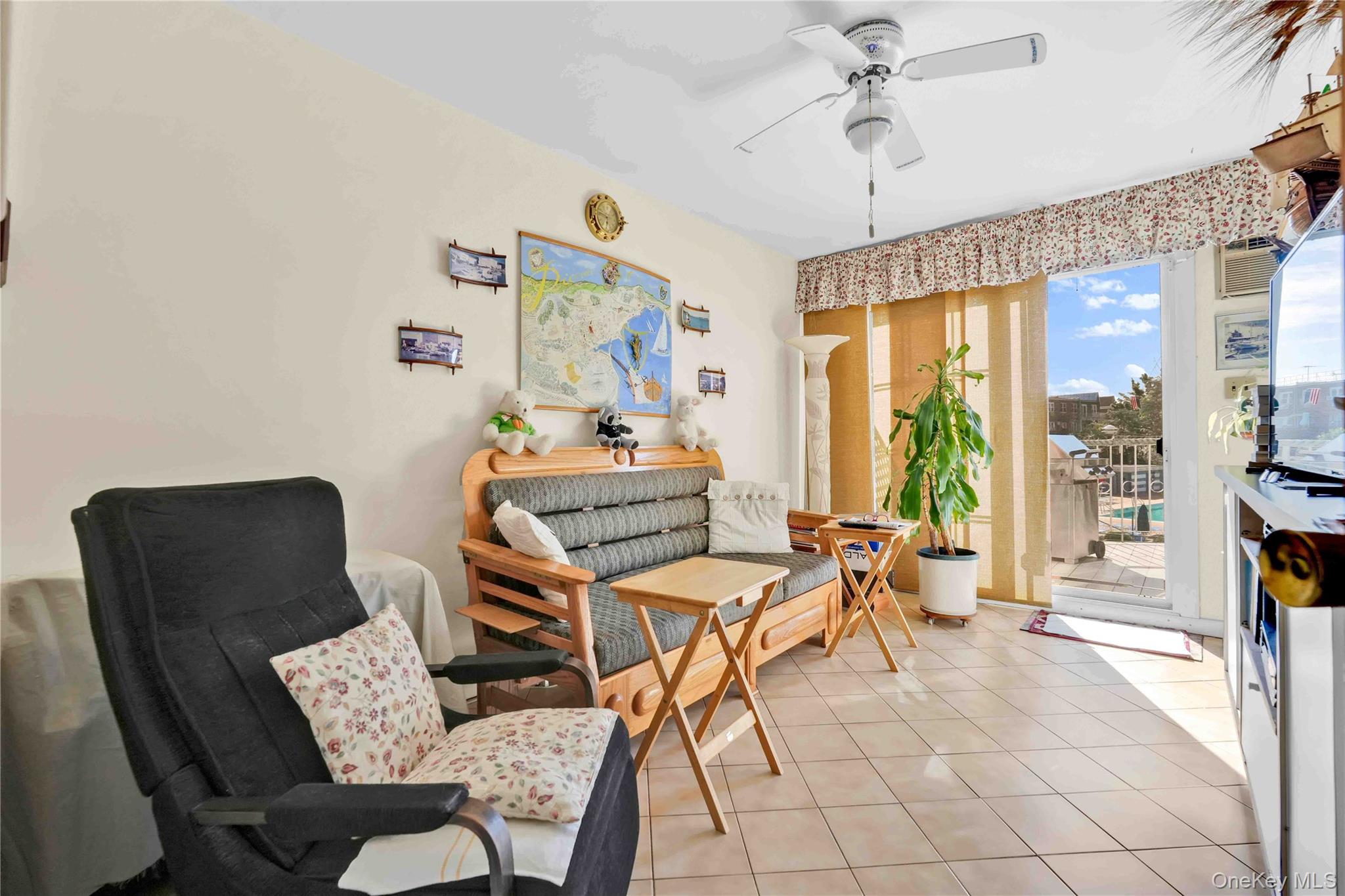 21260 16th Avenue Queens, NY 11360 - Photo 8 of 37 a workspace with furniture and a chandelier