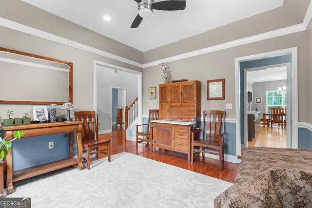 a bedroom with furniture and a lamp