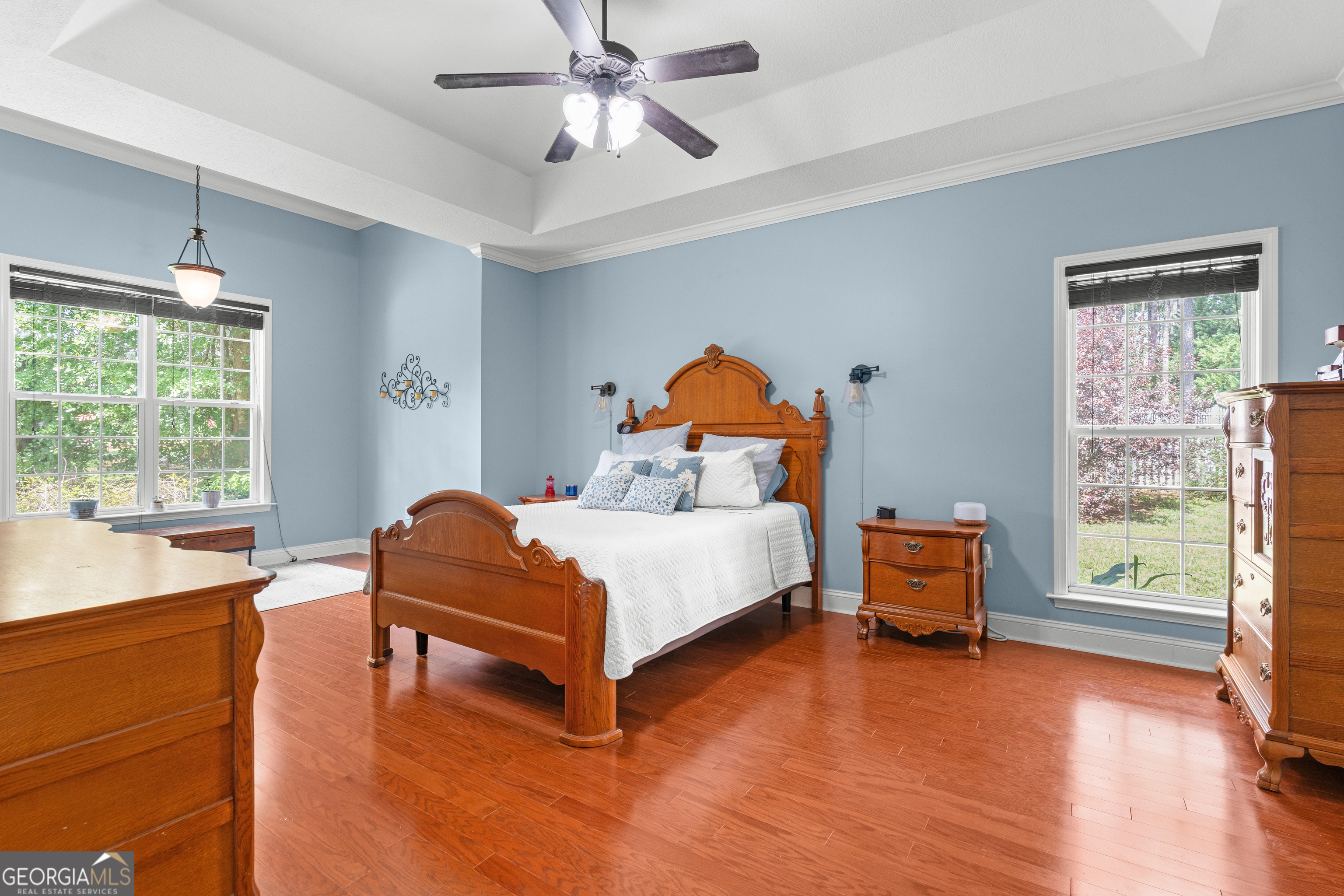 1603 Lennox Road Statesboro, GA 30461 - Photo 18 of 45 a bedroom with a bed and wooden floor