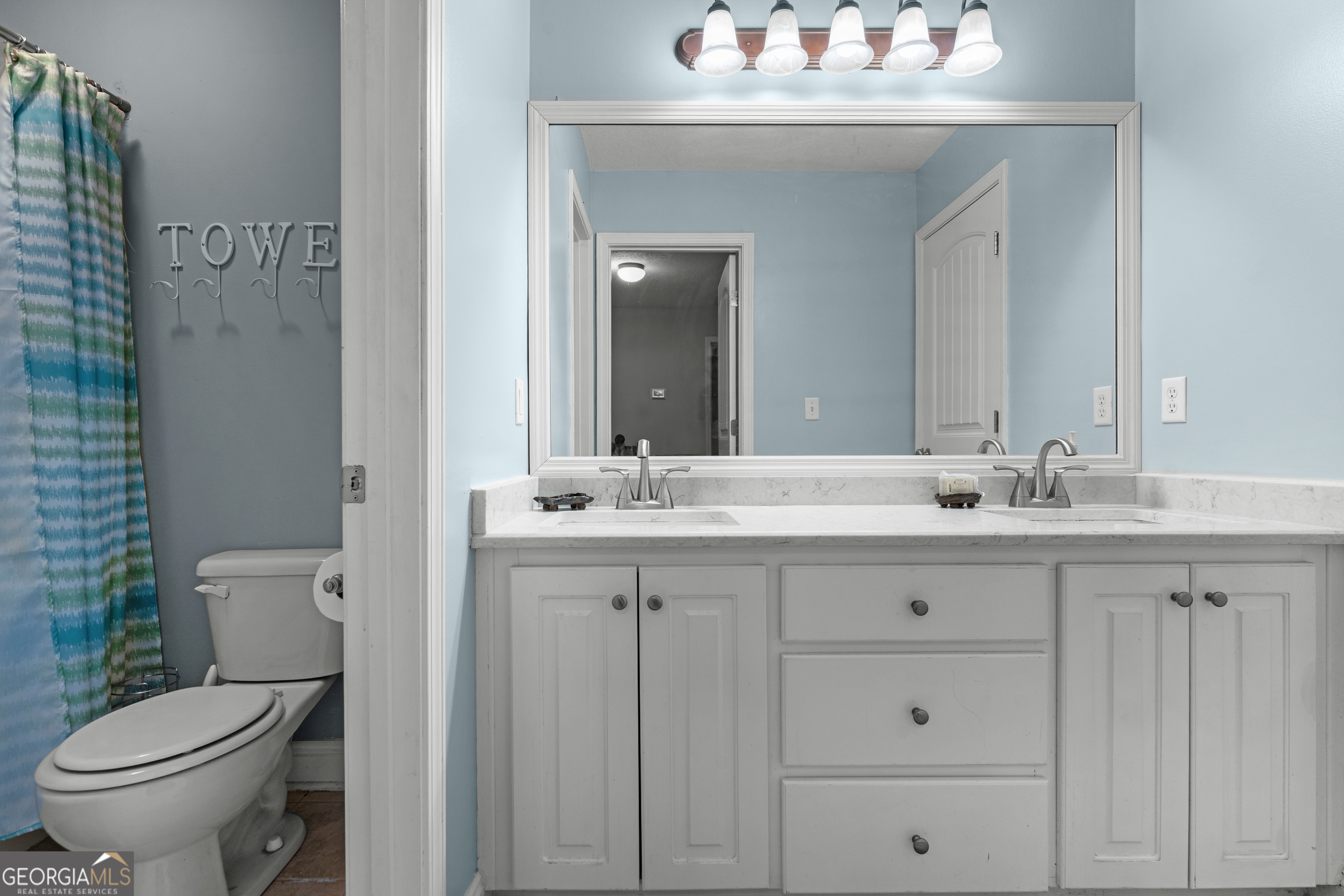 1603 Lennox Road Statesboro, GA 30461 - Photo 21 of 45 a bathroom with a granite countertop toilet sink and mirror
