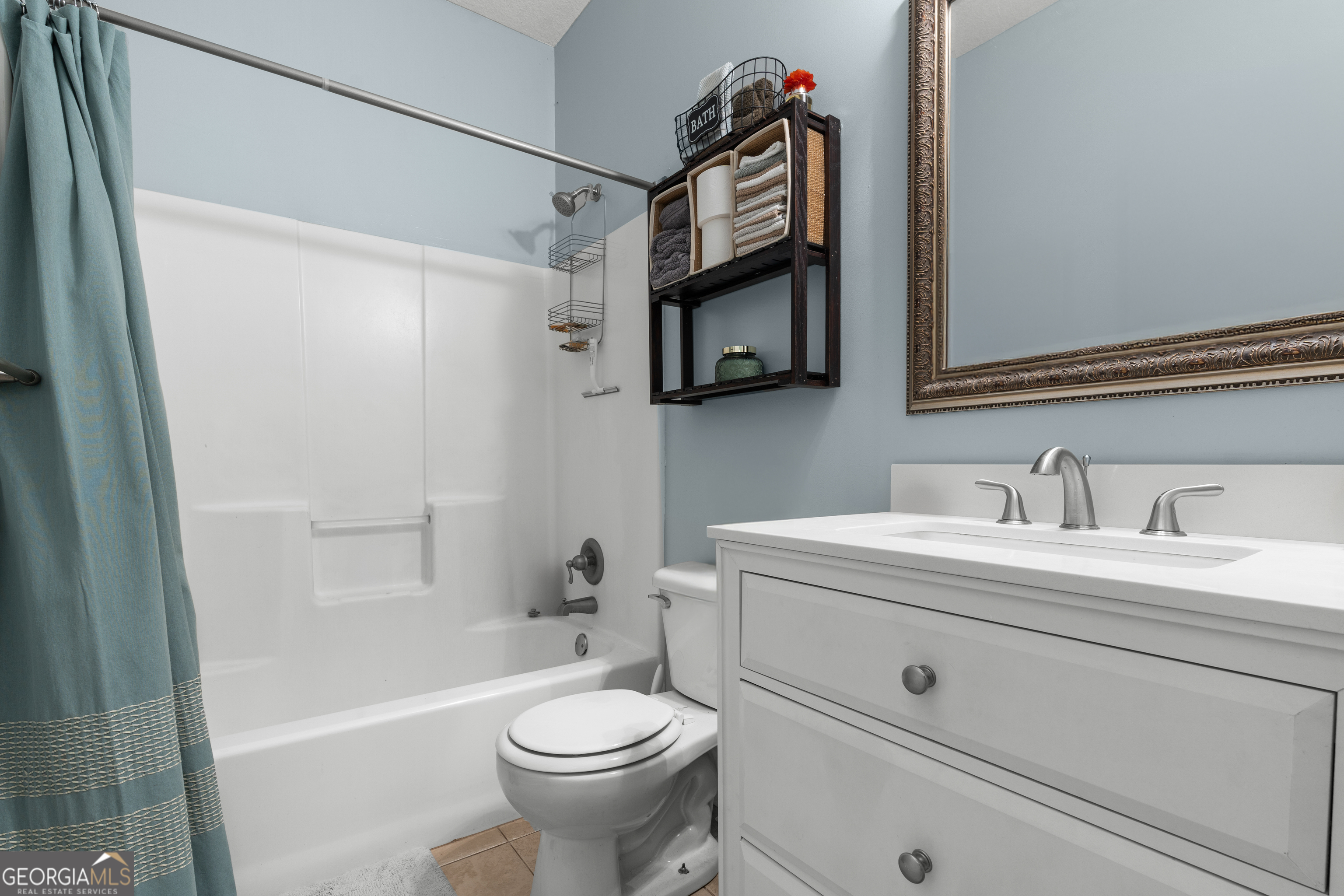 1603 Lennox Road Statesboro, GA 30461 - Photo 28 of 45 a bathroom with a sink a toilet and a mirror