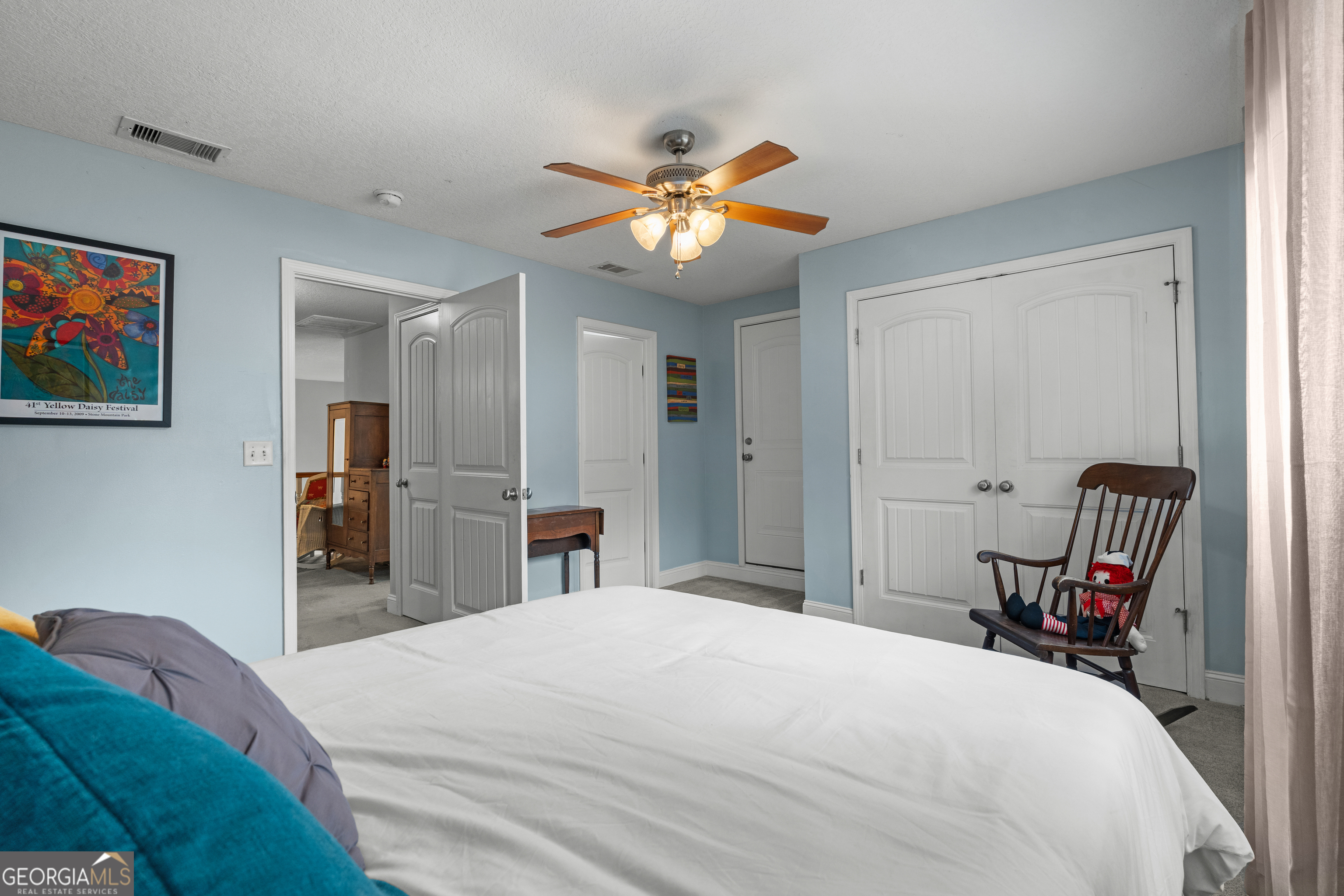 1603 Lennox Road Statesboro, GA 30461 - Photo 30 of 45 a bedroom with a bed and a chandelier