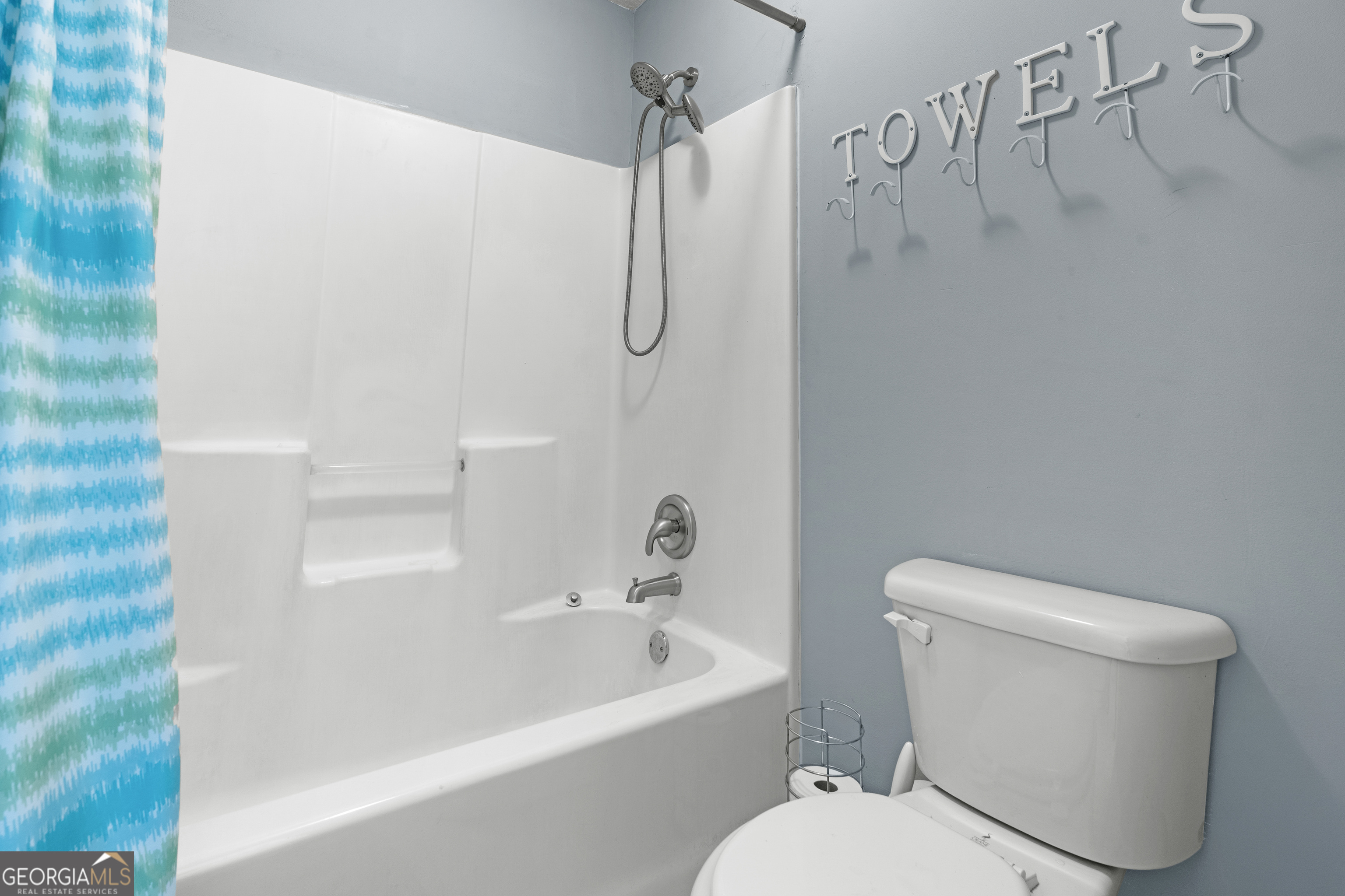 1603 Lennox Road Statesboro, GA 30461 - Photo 31 of 45 a white toilet sitting next to a bath tub