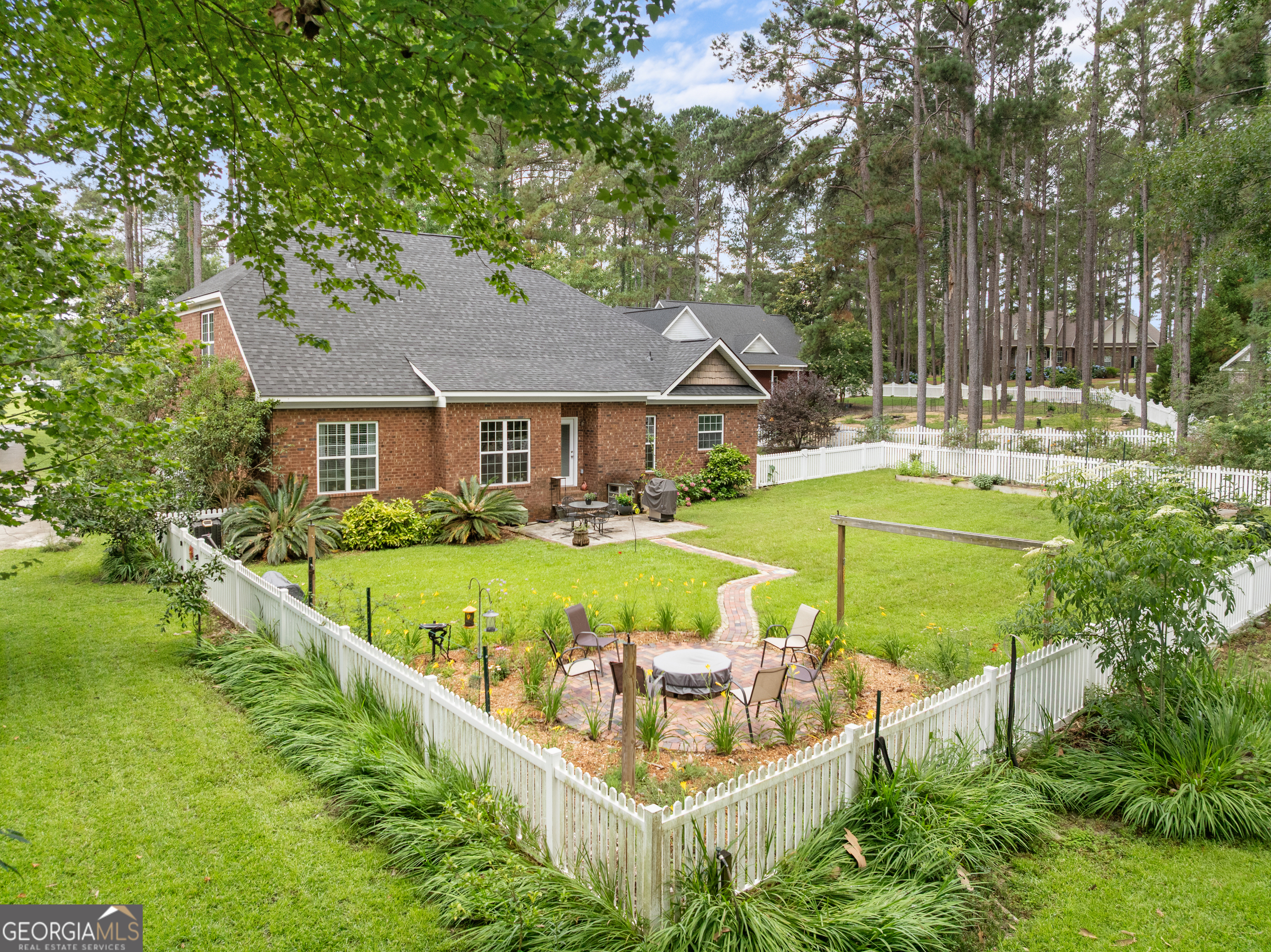 1603 Lennox Road Statesboro, GA 30461 - Photo 35 of 45 a view of a house with swimming pool and sitting area