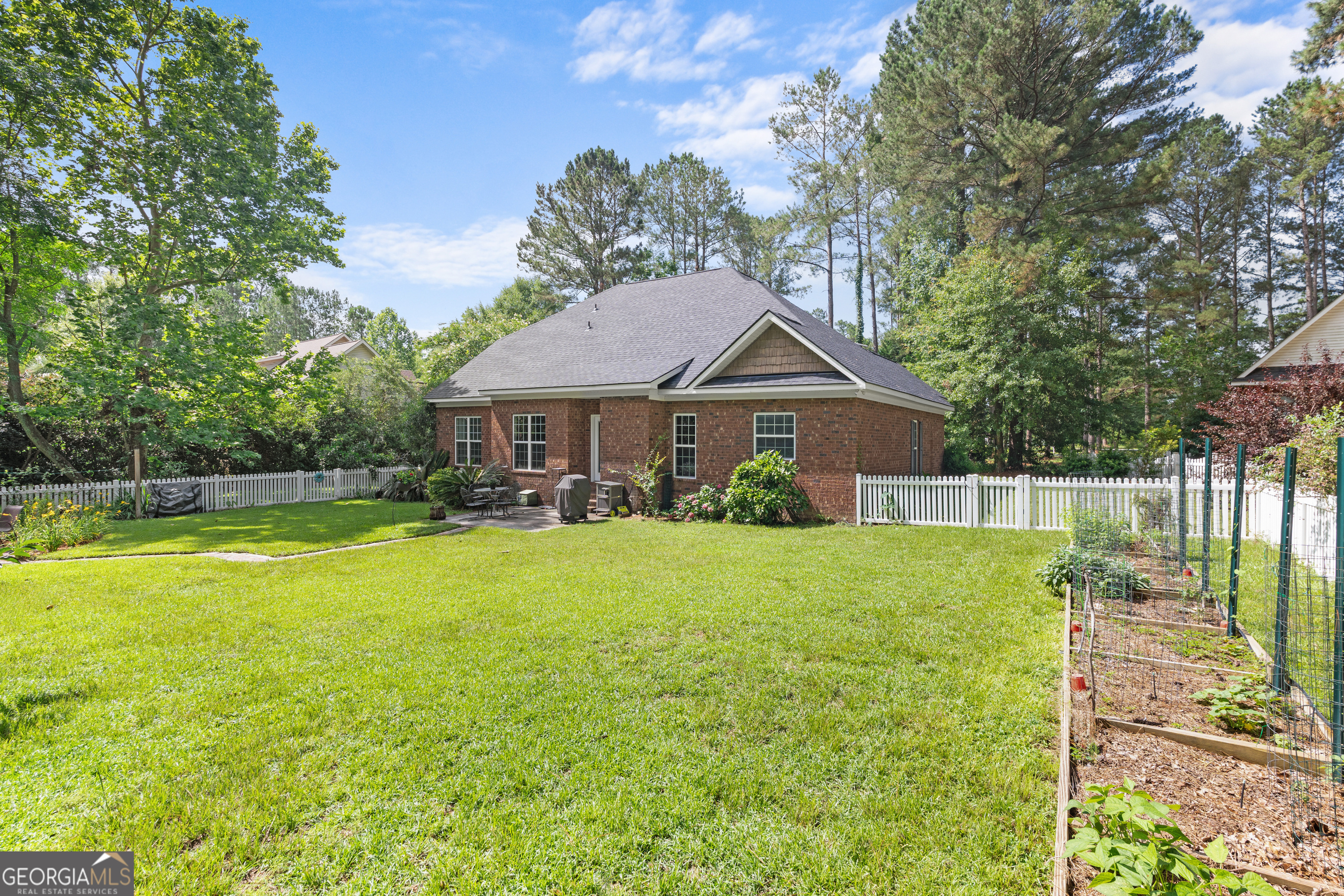 1603 Lennox Road Statesboro, GA 30461 - Photo 39 of 45 a front view of a house with garden