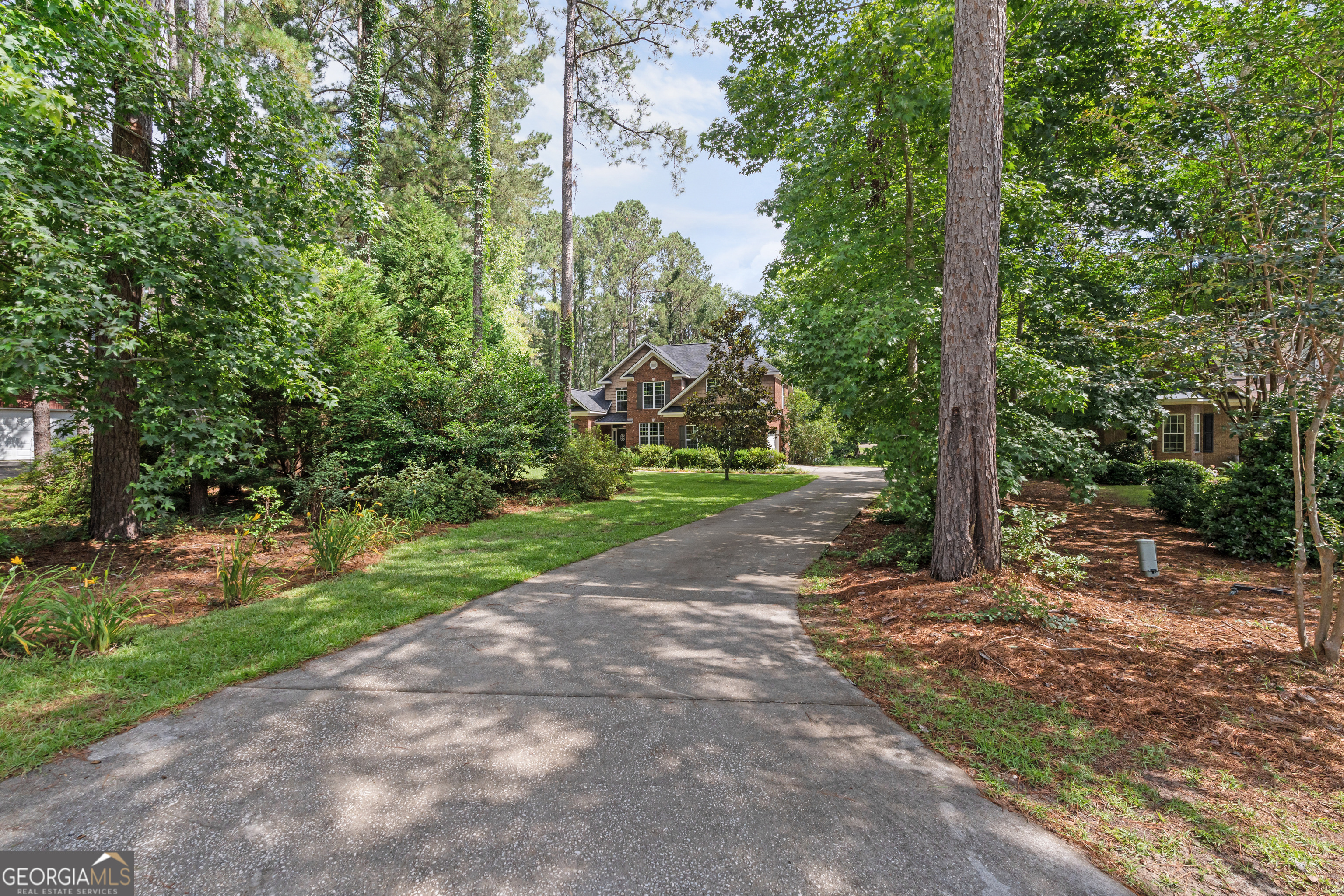 1603 Lennox Road Statesboro, GA 30461 - Photo 4 of 45 a view of a road with trees and a pathway