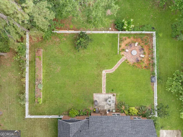 an aerial view of a houses with outdoor space
