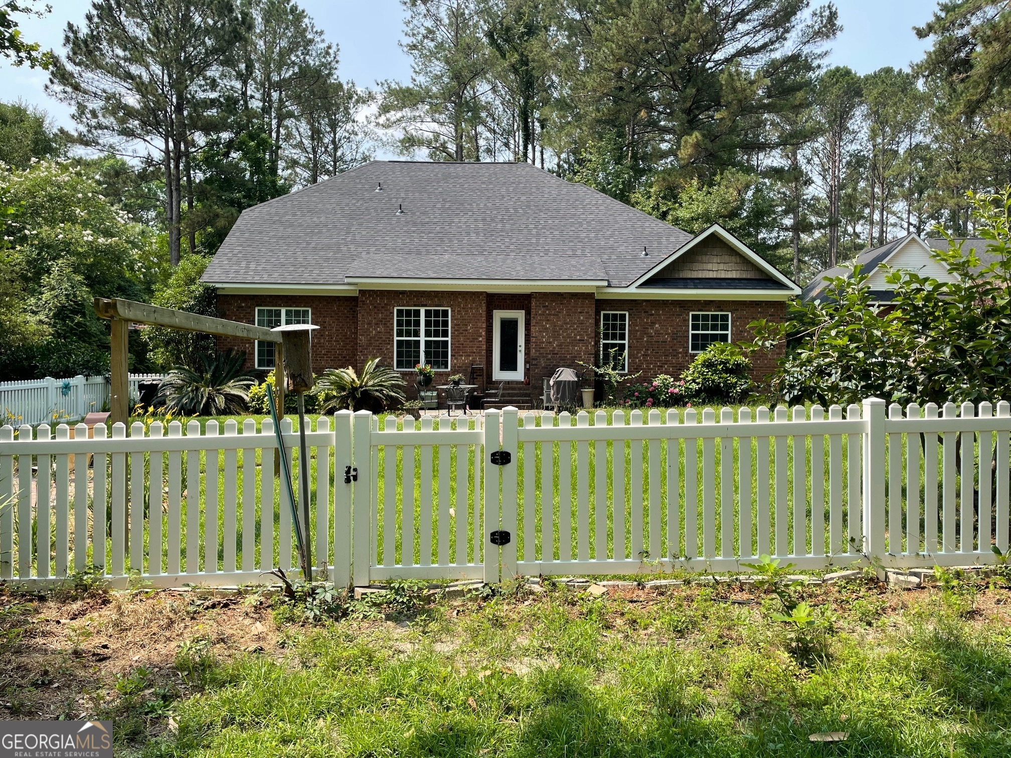 1603 Lennox Road Statesboro, GA 30461 - Photo 5 of 45 a front view of a house with a garden