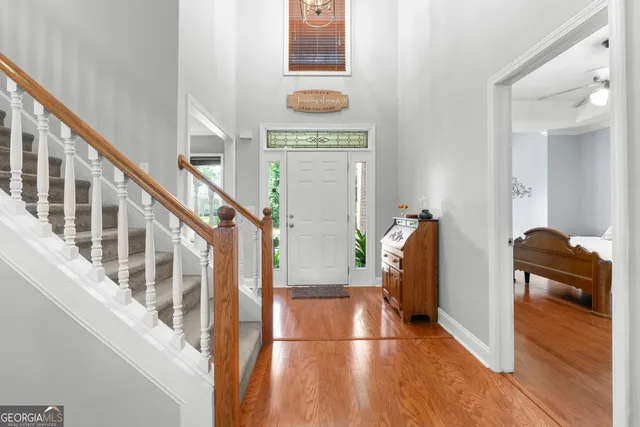 a view of an entryway with wooden floor