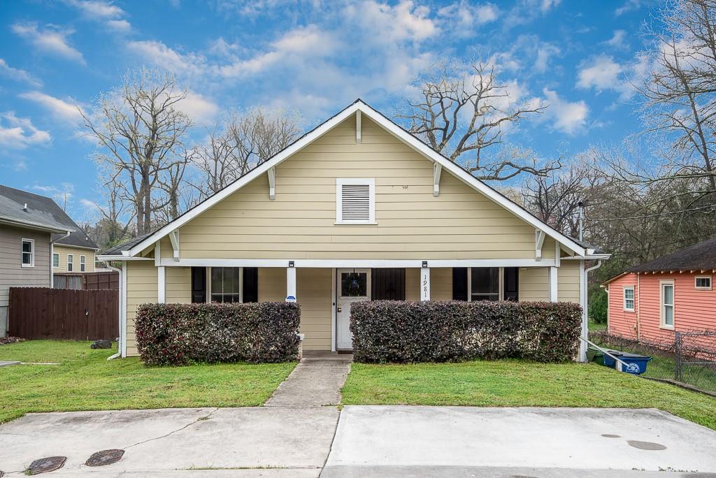 1981 Main Street Northwest Atlanta, GA 30318 - Photo 1 of 1 a front view of a house with a yard and garage