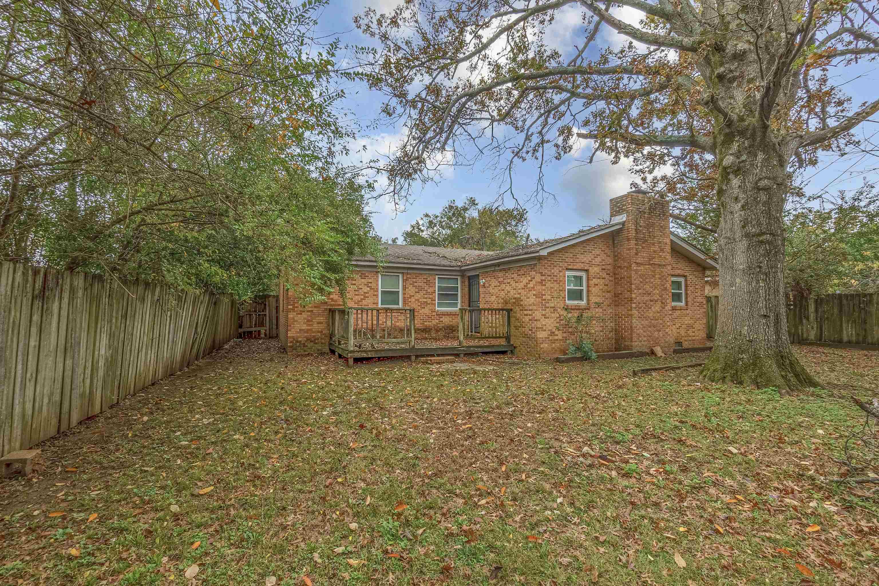3065 Randy Lane Memphis, TN 38118 - Photo 15 of 16 a house with trees in front of it