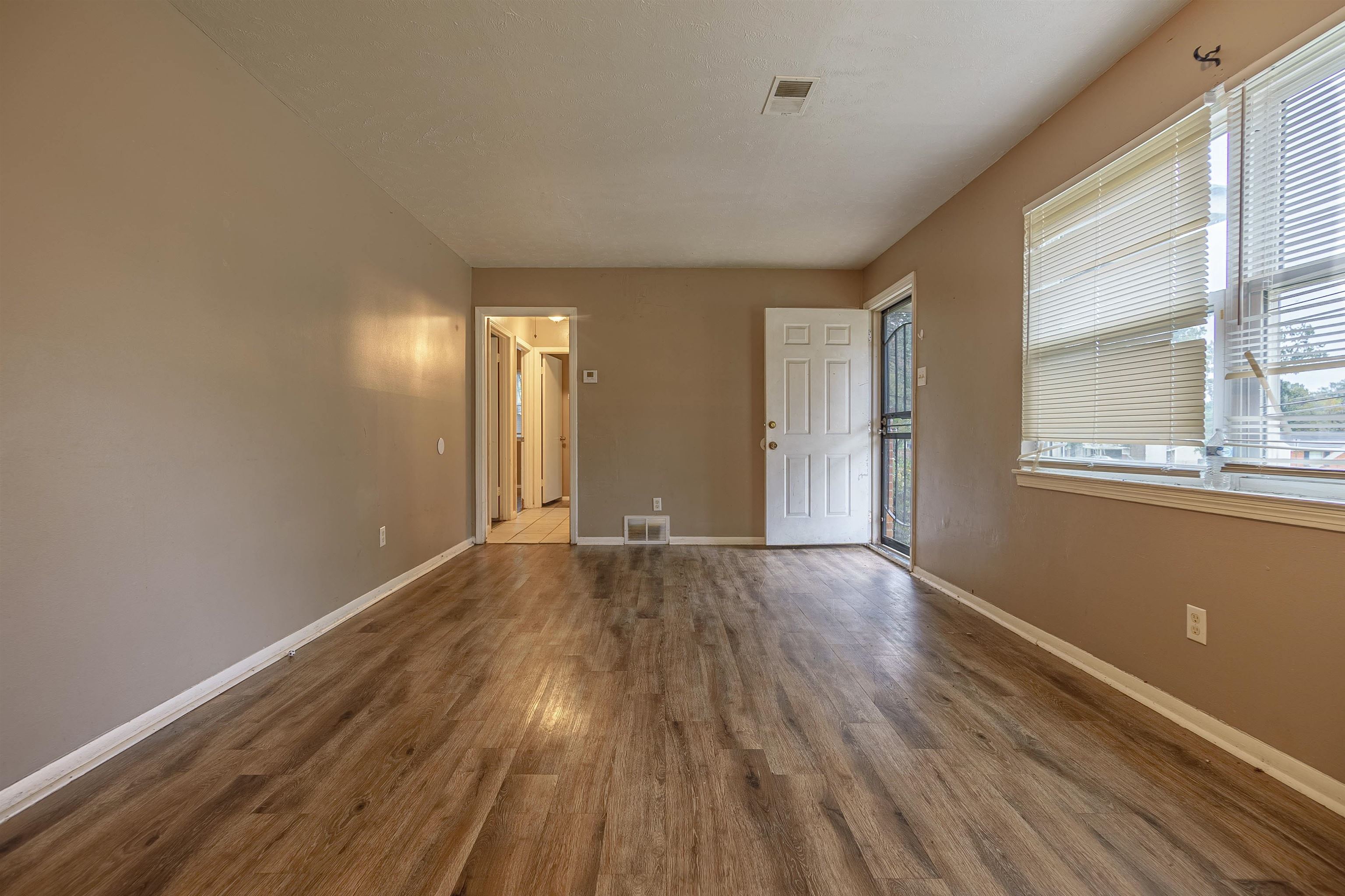 3065 Randy Lane Memphis, TN 38118 - Photo 7 of 16 a view of empty room with wooden floor and fan