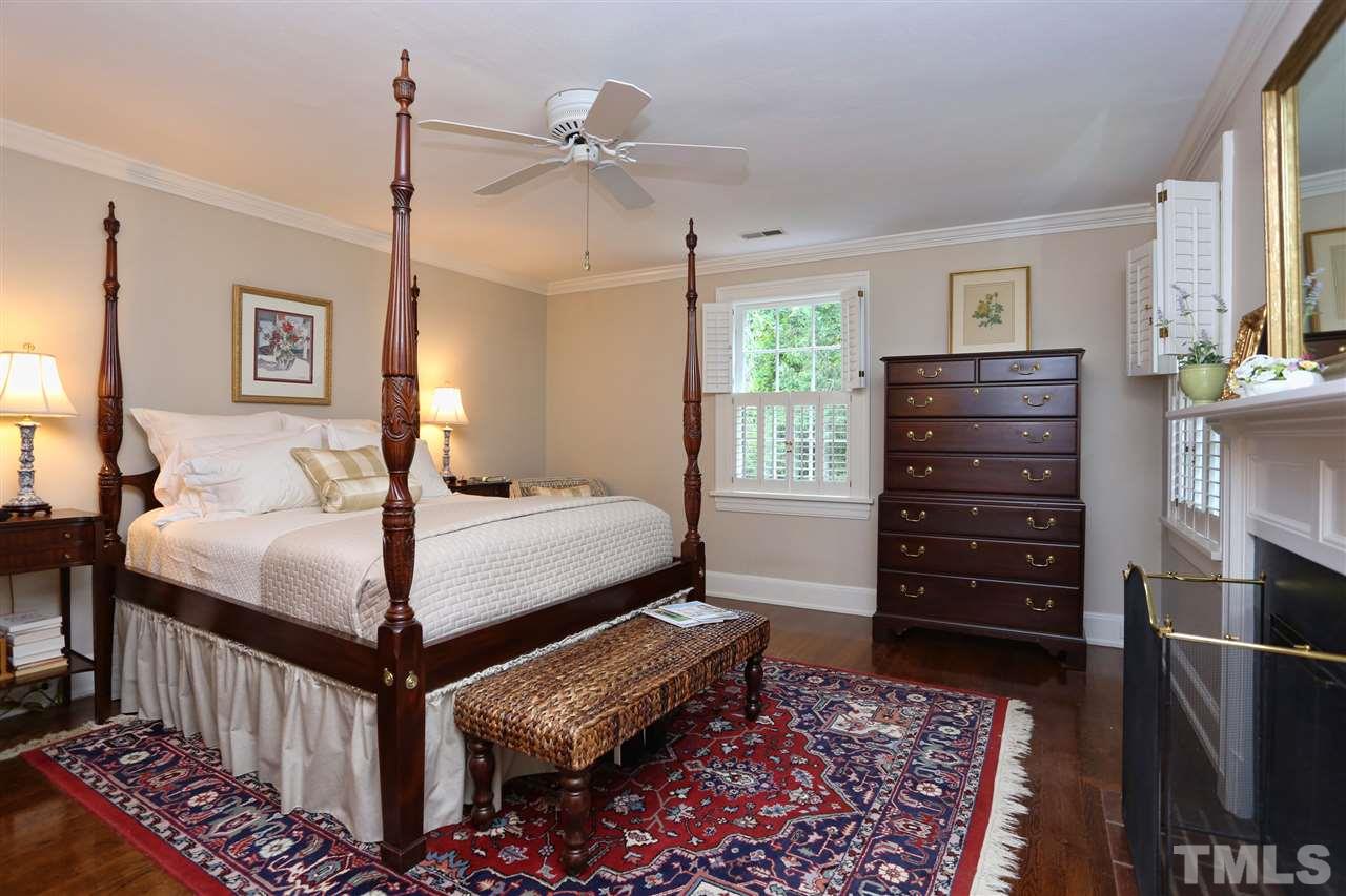341 Tenney Circle Chapel Hill, NC 27514 - Photo 12 of 21 a bedroom with a bed a dresser and a window