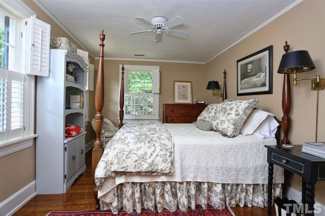 341 Tenney Circle Chapel Hill, NC 27514 - Photo 14 of 21 a bedroom with a bed and dresser with mirror