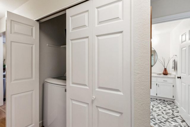 a view of a patio with couches table and chairs and potted plants
