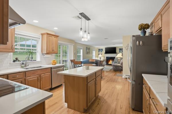 29 Hickory Hill Road Newburgh, NY 12550 - Photo 15 of 47 a kitchen with sink a refrigerator and wooden floor