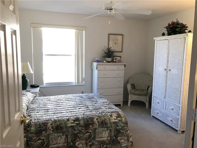 a bedroom with a bed and a closet