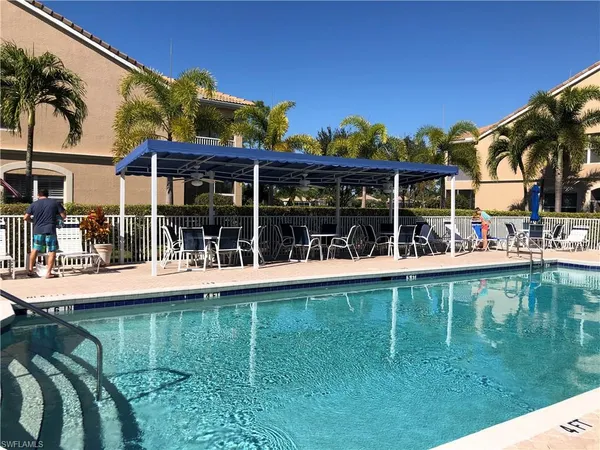 a view of a swimming pool with a patio