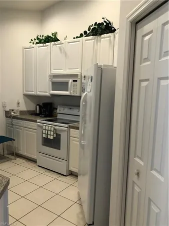 a kitchen with stainless steel appliances cabinets and a counter top