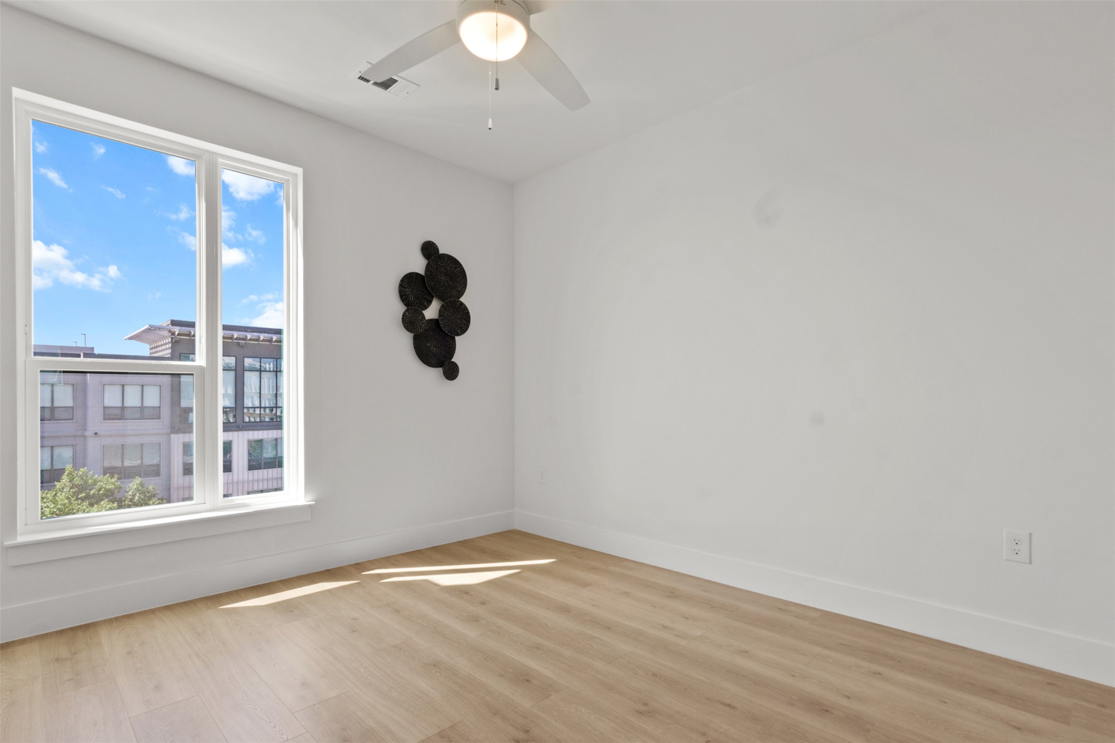 1701 Simond Avenue, Unit 418 Austin, TX 78723 - Photo 19 of 37 Spare room featuring light wood-style floors.