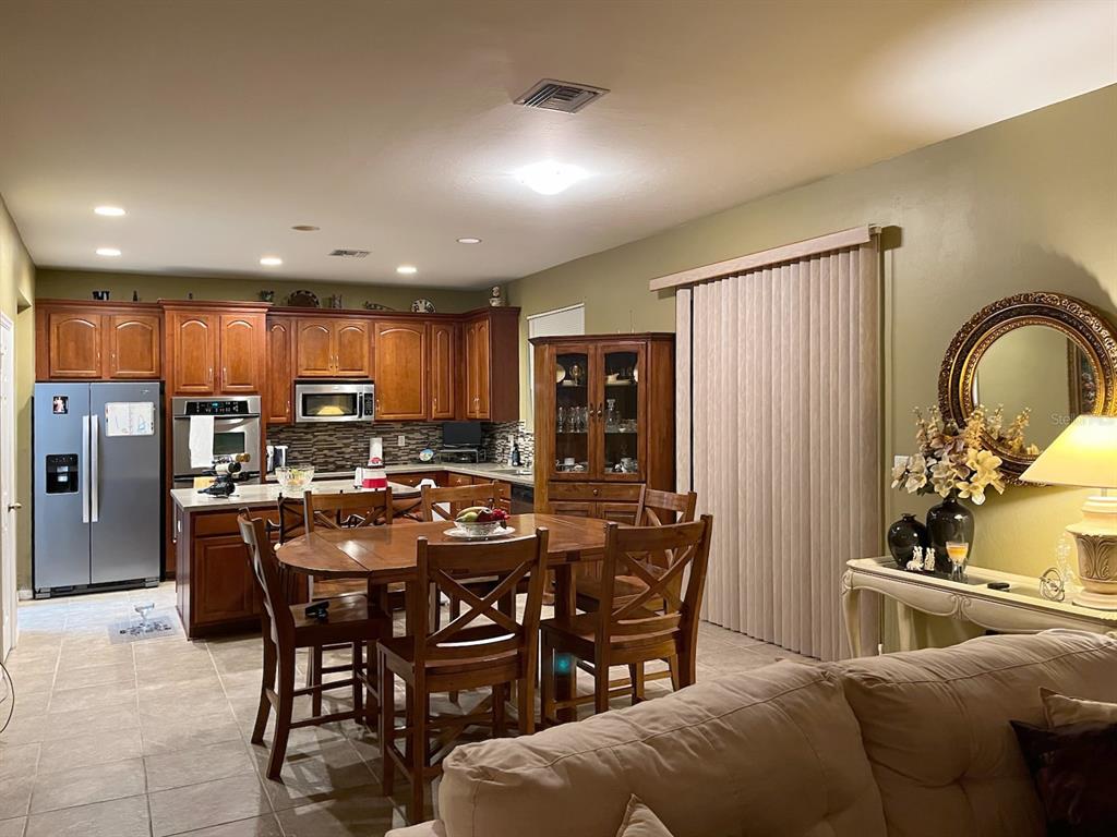 10025 Winding River Road Punta Gorda, FL 33950 - Photo 12 of 30 a view of a dining room with furniture