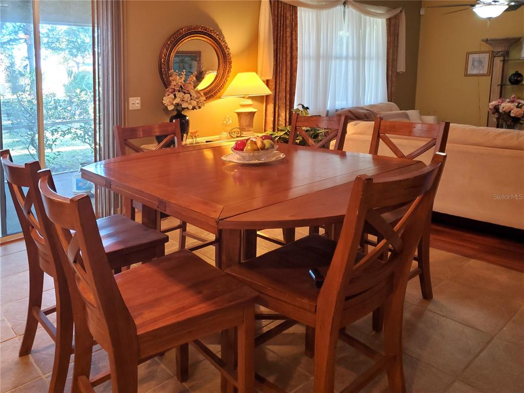 10025 Winding River Road Punta Gorda, FL 33950 - Photo 13 of 30 a view of a dining room with furniture and window