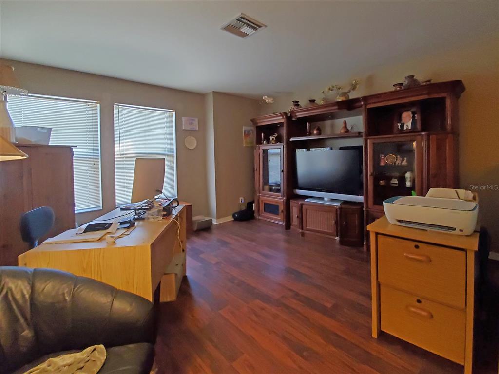 10025 Winding River Road Punta Gorda, FL 33950 - Photo 23 of 30 a living room with furniture and a flat screen tv