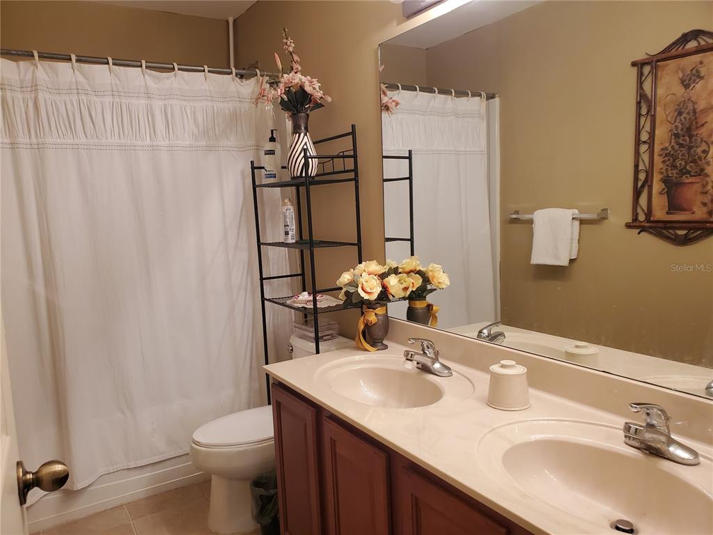 10025 Winding River Road Punta Gorda, FL 33950 - Photo 24 of 30 a bathroom with a sink toilet and shower