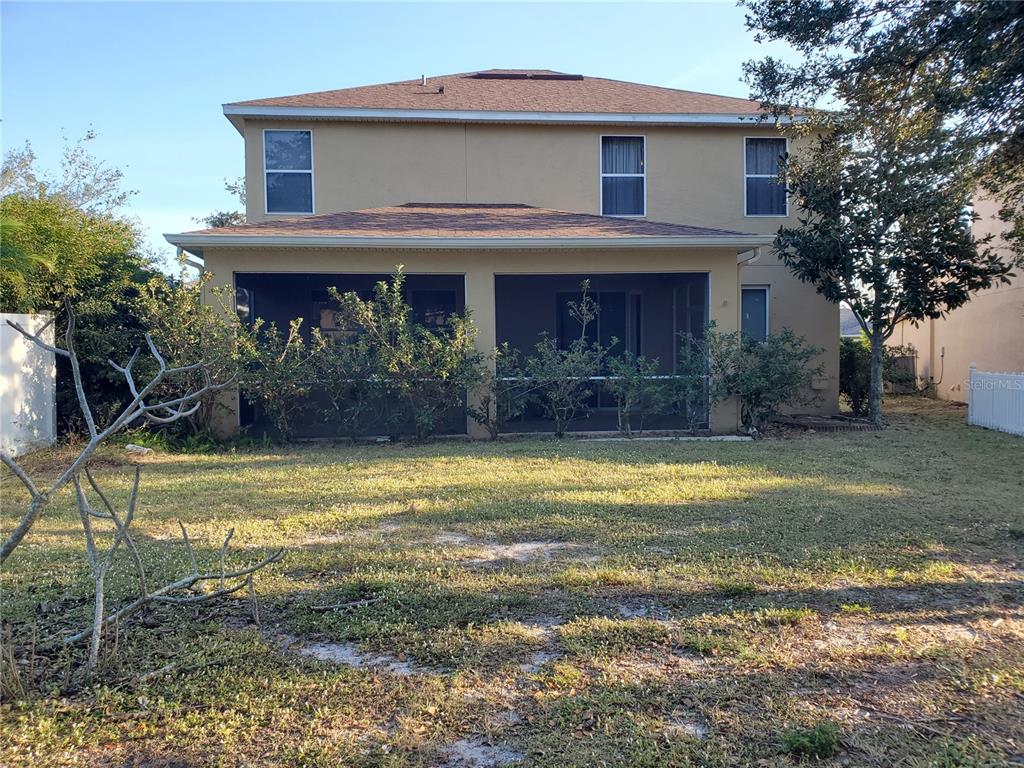10025 Winding River Road Punta Gorda, FL 33950 - Photo 27 of 30 a view of a house with a yard
