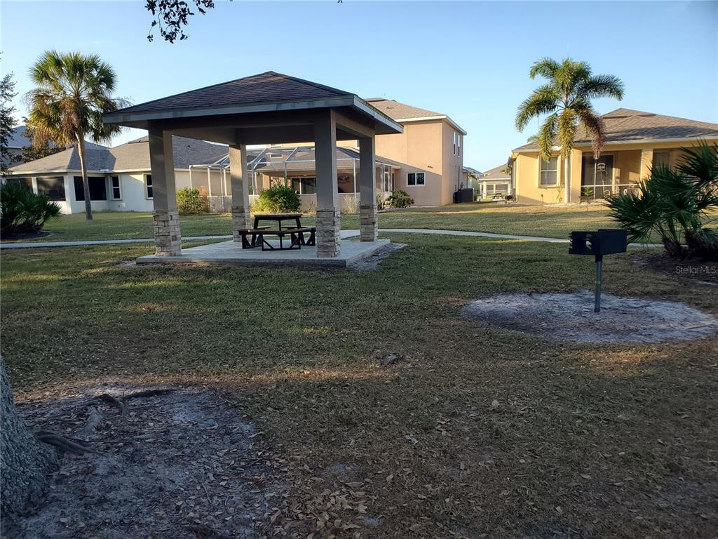 10025 Winding River Road Punta Gorda, FL 33950 - Photo 28 of 30 a view of a park with plants and large trees