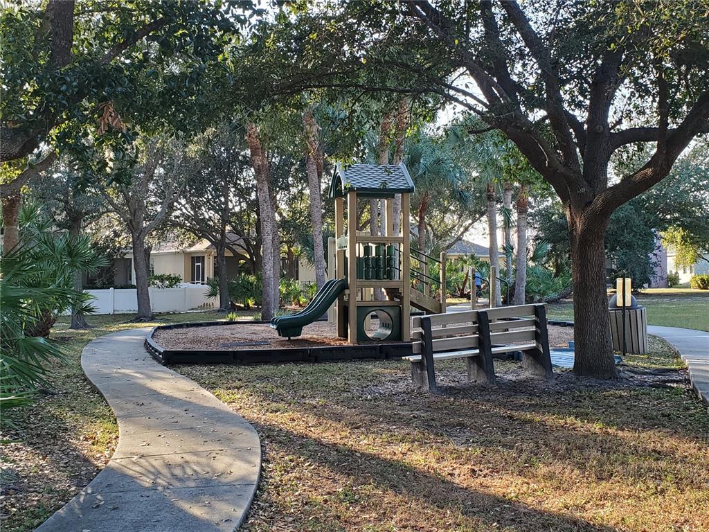 10025 Winding River Road Punta Gorda, FL 33950 - Photo 29 of 30 a view of a park with bench and trees