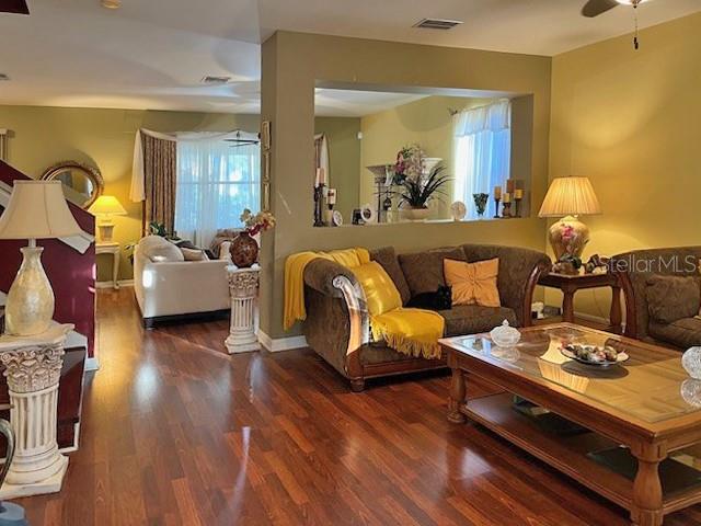 10025 Winding River Road Punta Gorda, FL 33950 - Photo 7 of 30 a living room with furniture and wooden floor