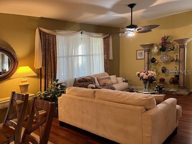 10025 Winding River Road Punta Gorda, FL 33950 - Photo 8 of 30 a living room with furniture and a chandelier