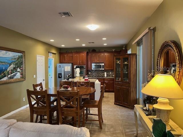 10025 Winding River Road Punta Gorda, FL 33950 - Photo 10 of 30 a view of a dining room with furniture