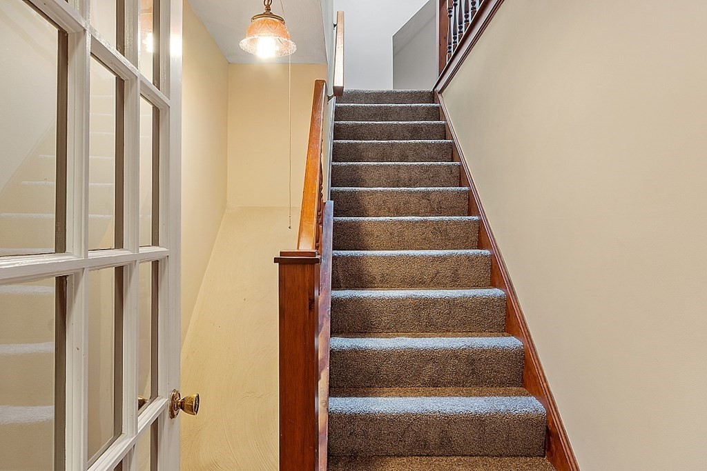 16 Galloway Road Chelmsford, MA 01824 - Photo 31 of 42 a view of staircase with white walls and a window