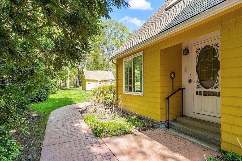 16 Galloway Road Chelmsford, MA 01824 - Photo 5 of 42 a front view of a house with a yard