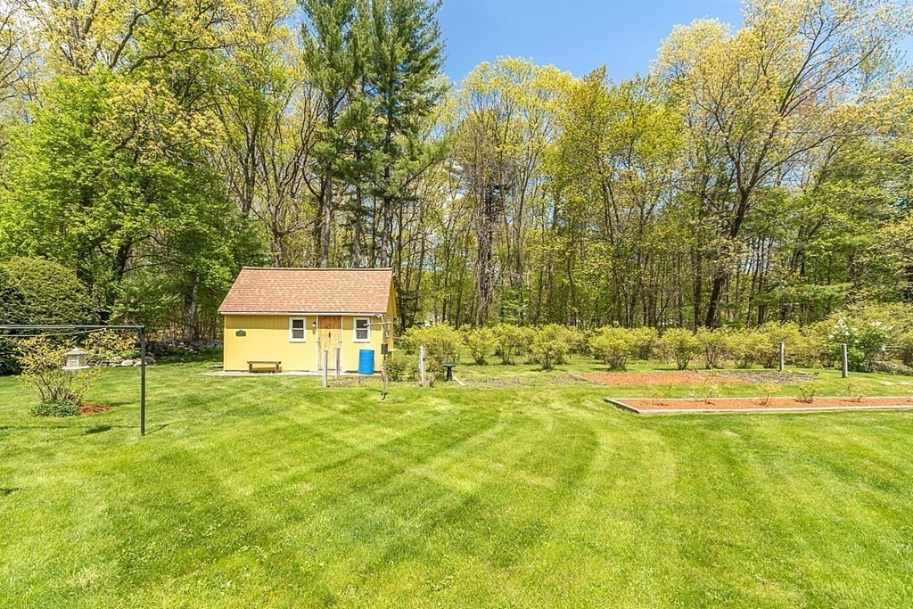 16 Galloway Road Chelmsford, MA 01824 - Photo 7 of 42 a house view with swimming pool in front of it