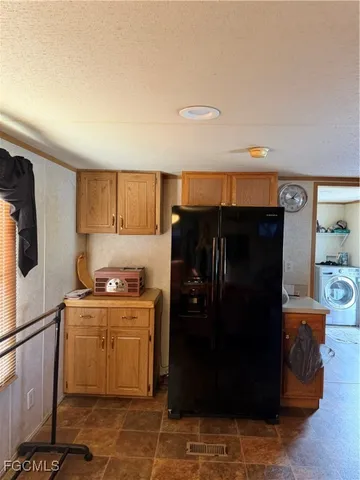 a kitchen with stainless steel appliances a sink stove and cabinets