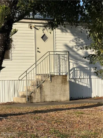 a view of a large house with a yard
