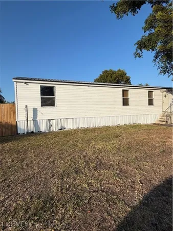 a view of a yard with a tree